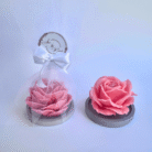 Website image description: pink scented candle in a shape of rose sitting on a wooden coaster in white mesh with custom label , perfect as wedding gift and door gift