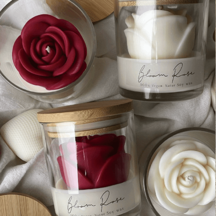 favours gift to the guests rose candle in white and red colours